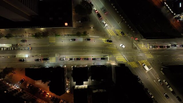 night illuminated flight over zurich city center traffic street crossroad aerial topdown panorama 4k switzerland 