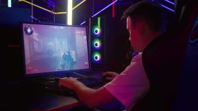 Player participating in the shooter video game competition. Player shooting at the enemy in the computer video game. Player defusing the bomb to secure the area in a shooter video game. FPS.