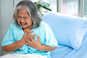 Heart attack concept. Asian Senior woman suffering from chest pain. - obrazy, fototapety, plakaty