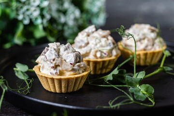 Dough tartlets with pate, mushrooms and salmon