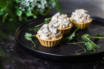 Dough tartlets with pate, mushrooms and salmon