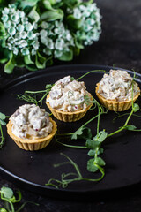 Dough tartlets with pate, mushrooms and salmon