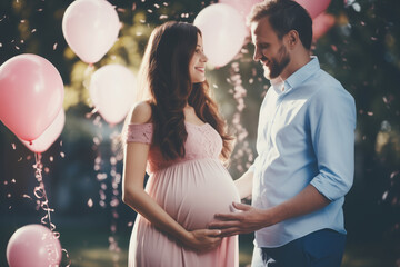 Beautiful young expecting couple surrounded by pink and blue balloons, confetti and streamers as a decorations at a gender reveal or a baby shower party.
