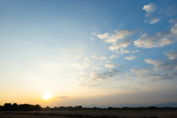 Beautiful sky and cloud at high. Landscape include space, light of nature, sunset, sunrise, horizon or skyline. Colorful with yellow, orange and blue at evening in autumn for background and wallpaper.