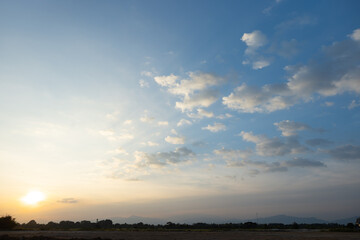Beautiful sky and cloud at high. Landscape include space, light of nature, sunset, sunrise, horizon or skyline. Colorful with yellow, orange and blue at evening in autumn for background and wallpaper.