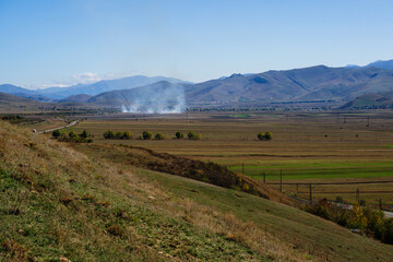 Fototapeta premium Smoky landmark with settlements and fileds, Armenia