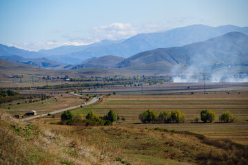 Smoky landmark with settlements and fileds, Armenia