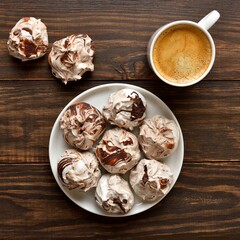 Chocolate meringue cookies and cup of coffee