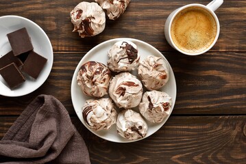 Chocolate meringue cookies and cup of coffee