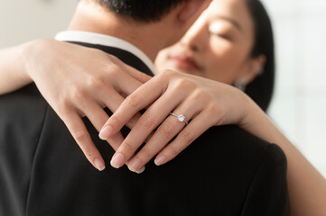 Close up of elegant wedding ring on the bride's finger, Love and marriage concept
