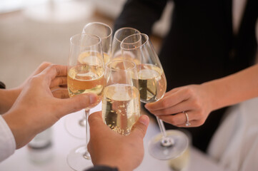 close up of Hands holding glasses of champagne at the wedding ceremony