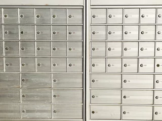 Foto op Canvas numbered safes in a post office located across the street © Vincenzo Rampolla