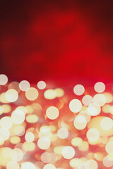 Beautiful abstract retro blurred red and gold bokeh lights background perfect for Valentines Day or Christmas.  