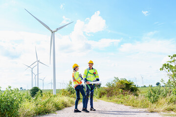 Architectural Engineering working and maintenance with wind turbine blueprint pictures of wind turbines at windmill field farm. Alternative renewable energy for better living concept.