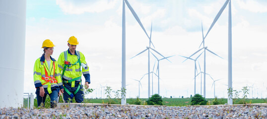 Architectural Engineering working and maintenance with wind turbine blueprint pictures of wind turbines at windmill field farm. Alternative renewable energy for better living concept.
