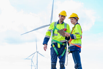 Architectural Engineering working and maintenance with wind turbine blueprint pictures of wind turbines at windmill field farm. Alternative renewable energy for better living concept.
