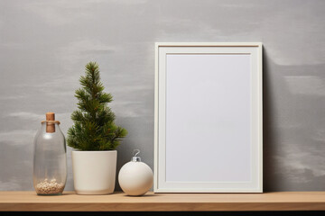 Empty white photo frame mock up on wooden table and winter holiday decor. Minimal Christmas poster