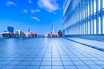 City square and skyline with modern buildings in Shenzhen at night, Guangdong Province, China.