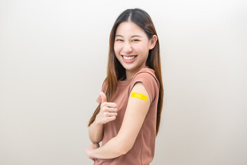 Healthcare of Covid-19, corona anti virus vaccination, happy asian young woman hand showing like at...