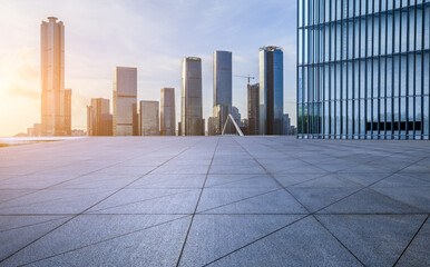 Fototapeta premium Empty square floor and modern city buildings background