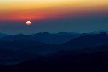 Tranquil Sunrise over Mountain Range