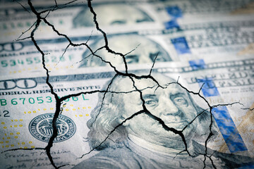 Cracked dollar finance system. Destroy, crisis global finance currency concept. Top view dollars...