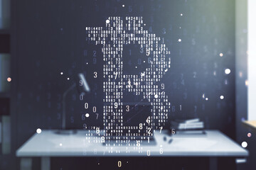Double exposure of creative Bitcoin symbol and modern desktop with laptop on background. Cryptocurrency concept