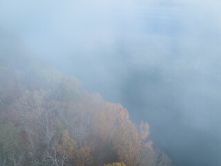 foggy morning over forest and the Tennessee River near Colbert Ferry Park, Natchez Trace Parkway - late November aerial view