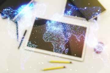 Multi exposure of abstract creative digital world map and digital tablet on background, top view, research and analytics concept