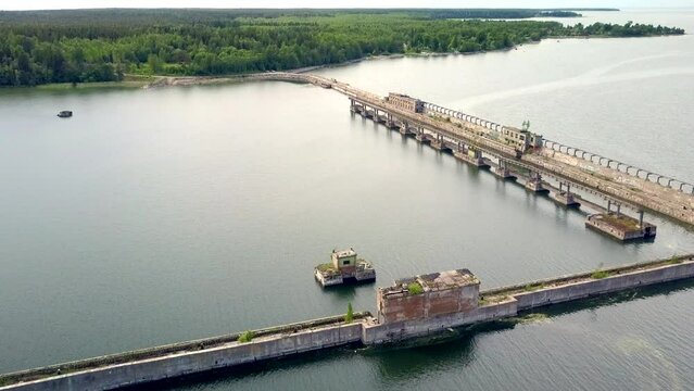 Estonia, Hara Bay-June 28, 2017: A very rare dilapidated naval base for demagnetization submarines during the Soviet era. High angle view. Camera slowly moves backwards.