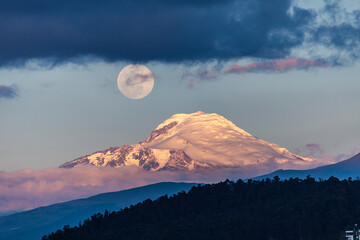 Cayambe volcano with the moon