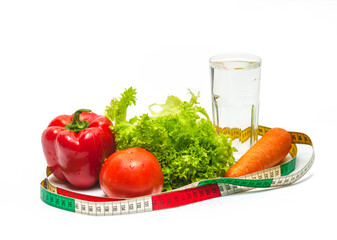 Fresh vegetables with glass of water for healthy eating and drinking. Centimeter tape. Weight loss.