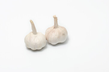 Two heads of raw garlic on a white background. Garlic close up isolated. Health concept.