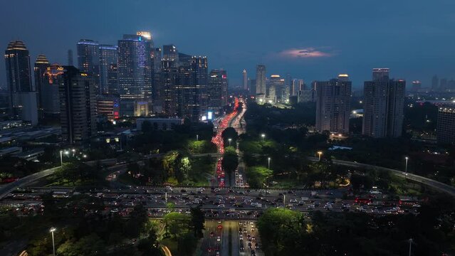 night illumination jakarta city downtown famous traffic street road interchange aerial panorama 4k indonesia