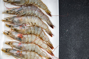 shrimp fresh langoustine raw prawn seafood fresh eating cooking appetizer meal food snack on the table copy space food background rustic top view 