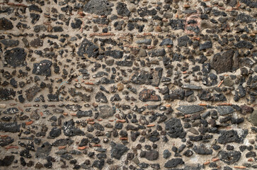 Old black stone wall closeup