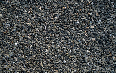 Small black gravel on road closeup