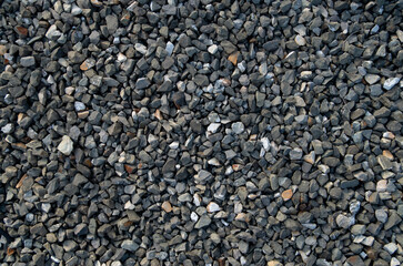 Small black gravel on road closeup