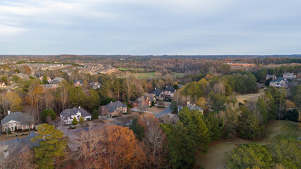 Aerial panoramic view of an upscale subdivision in suburbs of USA shot during golden hour in...