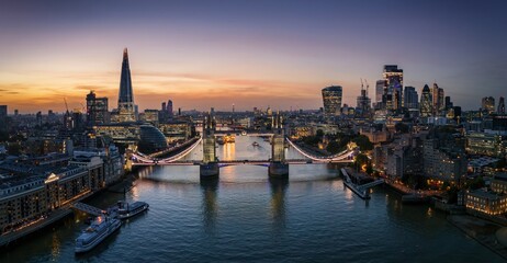 Panoramic aerial sunset view of the skyline of London, England, with Tower bridge and the City...