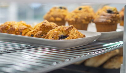 Fresh pastries on display, morning breakfast sweet food background, copy space image