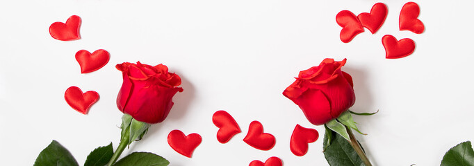Bouquet of red roses and hearts on a white background. Valentine's day concept. Place for your text.