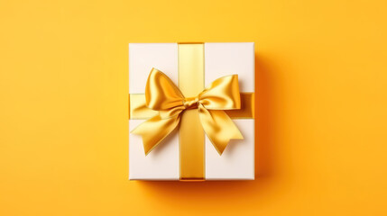 Obraz na płótnie Canvas Gift box with golden ribbon on bright background