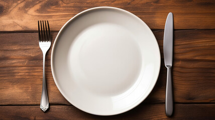 Empty plate with fork and knife on wooden table, Served cutlery, minimal table setting