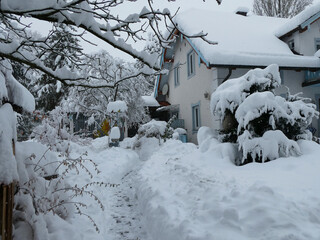 Bavaria under snow storm December 1st 2023, urban view of a residential quarter with vegetation and...
