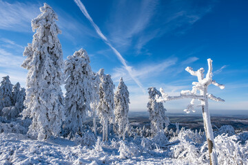 Deep snow-covered winter landscape on the Großer Feldberg in Taunus/Germany on a sunny day
