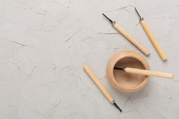 Carpenter tools with wooden objects on concrete background ,top view