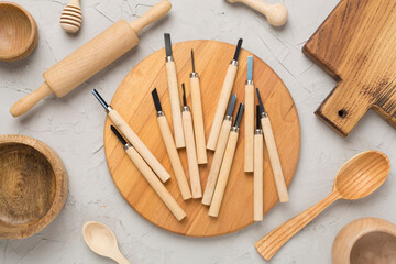 Carpenter tools with wooden objects on concrete background ,top view