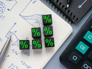 Cubes on a notepad as a concept for the growth of interest on a loan or deposit, profit.