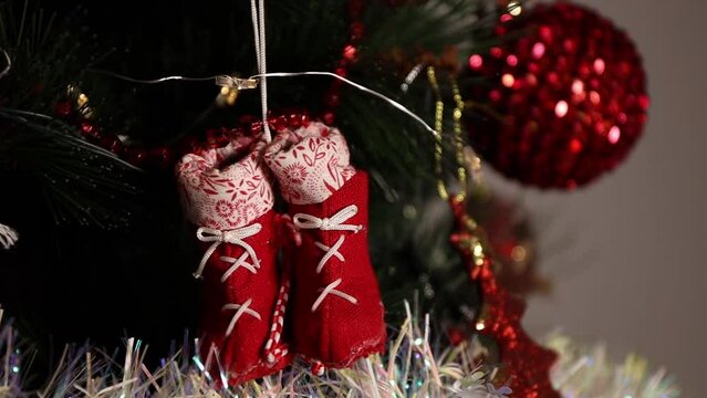 Christmas tree decoration. Toys and garlands close-up, slow motion